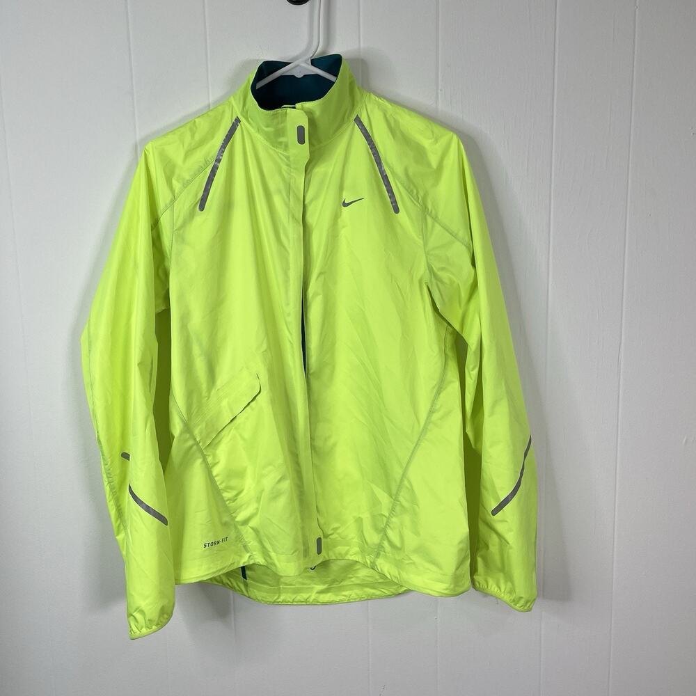 NIKE Women's StormFly Lightweight Reflective Rain Jacket Zest Neon Yellow M